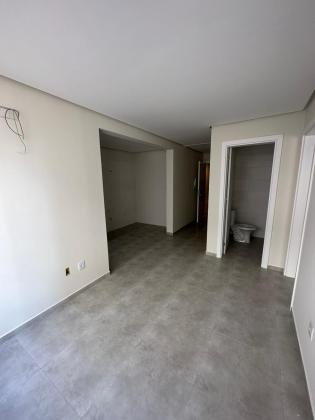 Apartamento em Tramandaí a venda com 40 m2 composto por 1 suíte grande, lavabo, cozinha com churrasqueira, 1 Box de garagem.