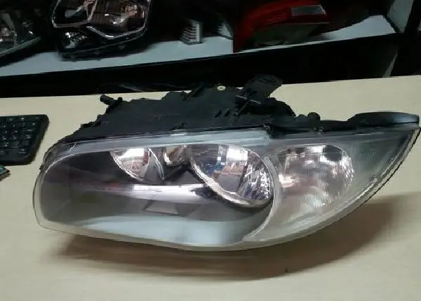 Farol bmw série 1 original esquerdo 116 118 120 cinza( 2005 2006 2007 2008 2009.)