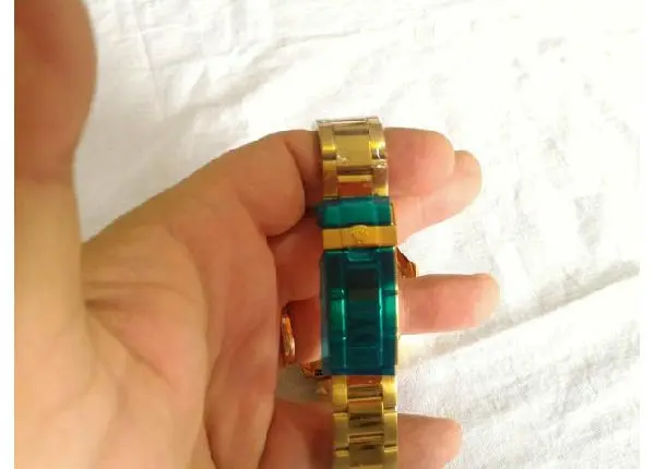 Relógio Rolex Submariner Dourado Fundo Azul